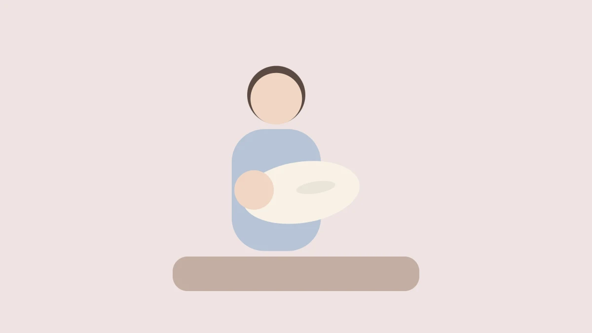 座って赤ちゃんに授乳するママ